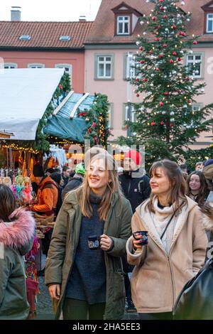 two friends experience the christmas market in bamberg,bavaria,germany Stock Photo