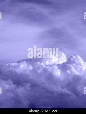 clouds in the sky toned in light purple color, nature background, film grain noise effect Stock Photo