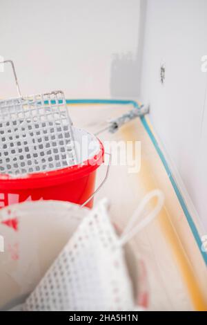 construction site,refurbishment and renovation of an apartment,detail of paint buckets Stock Photo