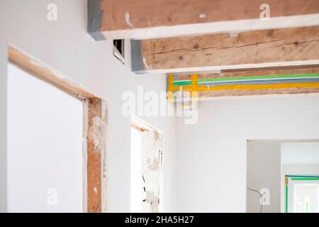 construction site,refurbishment and renovation of an apartment,detail of beams of a ceiling Stock Photo