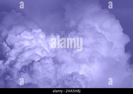 clouds in the sky toned in light purple color, nature background, film grain noise effect Stock Photo