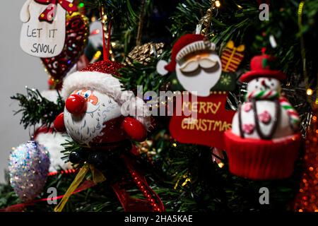 Closeup shot of ornaments and decorations on Christmas tree Stock Photo