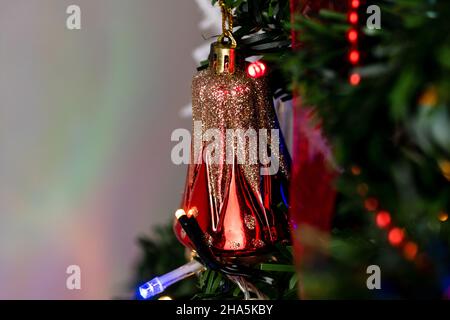 Closeup shot of ornaments and decorations on Christmas tree Stock Photo