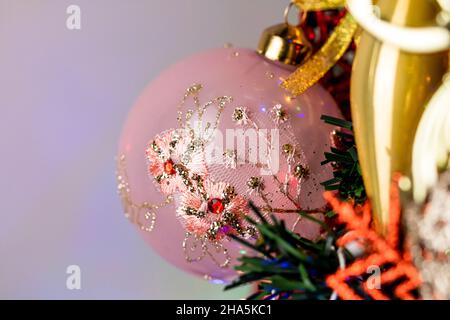 Closeup shot of ornaments and decorations on Christmas tree Stock Photo