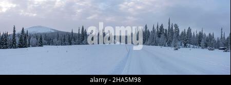 snow-covered road,pallastunturi,raattama,muonio,lapland,finland Stock Photo