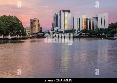 Evening view of Sarawak river in the center of Kuching, Malaysia Stock Photo