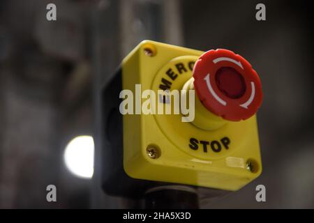 Red emergency stop button close-up Stock Photo