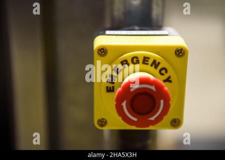 Red emergency stop button close-up Stock Photo