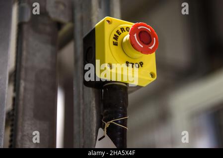 Red emergency stop button close-up Stock Photo