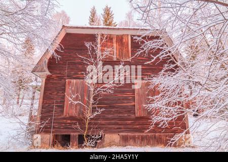 abandoned cottage in winter landscape Stock Photo