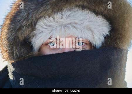 portrait of a young woman,fur hat,scarf,eyes,blue,bavaria,germany Stock Photo