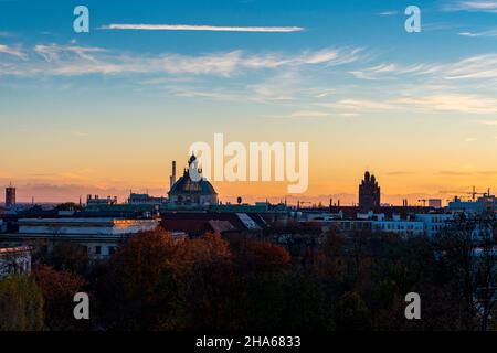 view over munich with the dome of the justitzpalast and the towers of the higher regional court that stand out in the evening sky Stock Photo