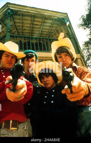 1967, Los Angeles, California, USA: Pop stars with cowboy hats and guns, MICHAEL NESMITH, PETER TORK, MICKY DOLENZ and DAVEY JONES during filming of the TV Show 'THE MONKEES.' (Credit Image: © Globe Photos/ZUMA Wire) Stock Photo