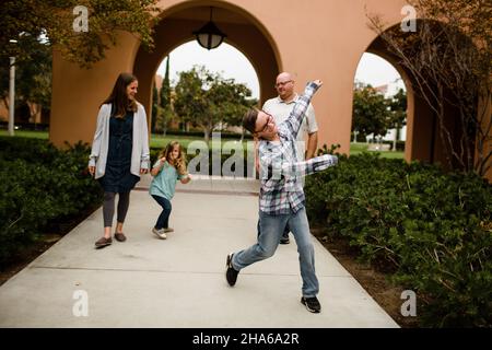 Ten Year Old Photo Bombing Family in San Diego Stock Photo