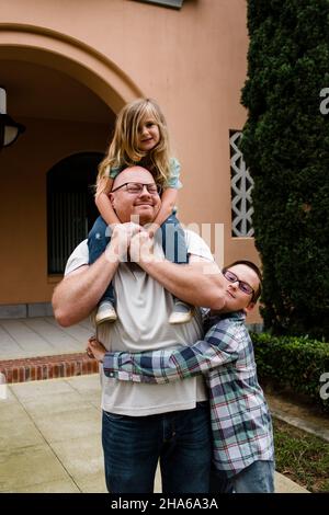 Dad & Kids Posing for Camera at Liberty Station in San Diego Stock Photo