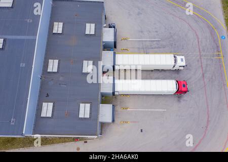 Aerial View of Loading Warehouse with Semi Trucks Parked Stock Photo