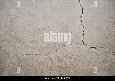 Cracked exposed concrete wall texture grungy backdrop Stock Photo