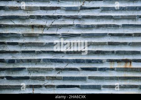 Traditional slate stone bricks and white concrete wall, mountain architecture detail Stock Photo