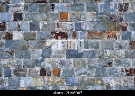 Rustic stone slate bricks wall facing ceramic porcelain tiles stonewear Stock Photo