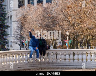 Young couple taking a selfie. Millennium Park, Chicago, Illinois. Stock Photo