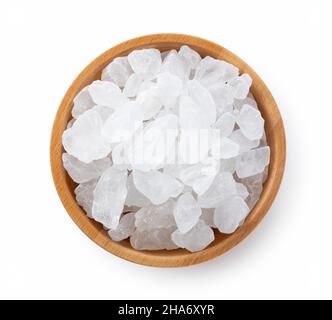 rock candy in a wooden bowl on a white background. View from above. Stock Photo