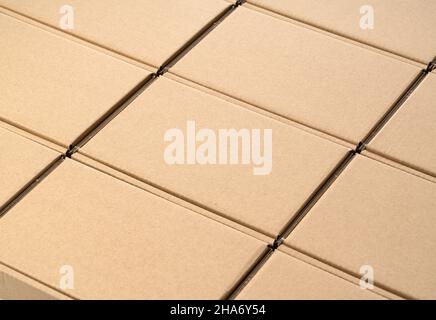 Neatly arranged cardboard boxes on a white background. Shipping Concept Stock Photo