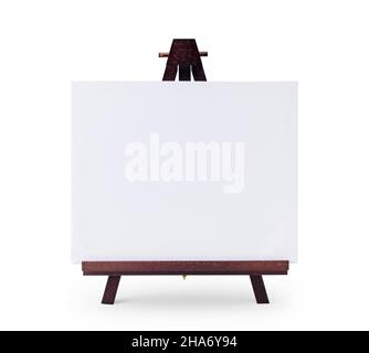 White mini canvas on a small dark brown wooden easel stand Stock Photo