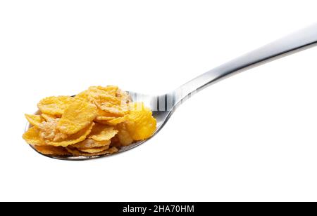 Corn flakes on the spoon isolated on white Stock Photo