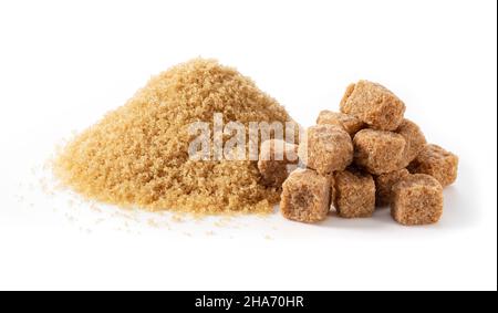 Brown cane sugar powder and brown sugar cubes placed on a white background. Stock Photo