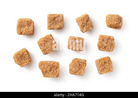 Brown cane sugar cubes placed on a white background. View from directly above. Stock Photo