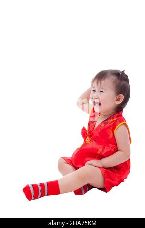 Little asian girl (thai) in traditional chinese dress, cheongsam is typical china dress, identity culture of Chinese New Year festival. Stock Photo