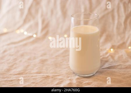 milk in glass, on white fabric Stock Photo