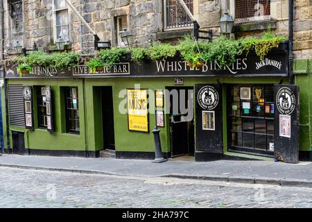 Edinburgh, Scotland, 11 June 2019: Main entry to Whistle Binkies Live Music Bar in a cloudy rainy summer day Stock Photo