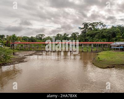 Amazon River, Peru - May, 2016:  Wooden bridge in the small village on the bank of the Amazon River. Amazonia. South America. Stock Photo
