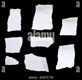 White torn paper on black background Stock Photo