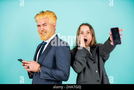 Billionaire. bearded dad dyed hair. kid oversized jacket. Business people discussion. Successful family team. entrepreneurship. business negotiation Stock Photo