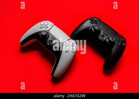 Ukraine - December 10, 2021.Wireless PlayStation 5 Dualsense gamepads. Stock Photo