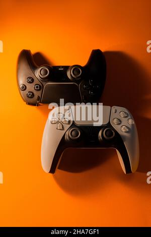 Ukraine - December 10, 2021.Wireless PlayStation 5 Dualsense gamepads. Stock Photo