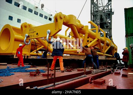 Heavy off-shore drilling equipment, being loaded onto a container vessel in the Port of Hamburg  Germany. Stock Photo