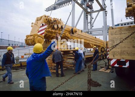 Heavy cargo, a mobile crane, being loaded onto the upper deck of a ro-ro vessel in the port of Hamburg, Germany. Stock Photo