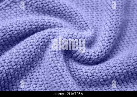 Color of the year 2022 very peri. Knitted sweater texture closeup. Trendy soft abstract background. Stock Photo