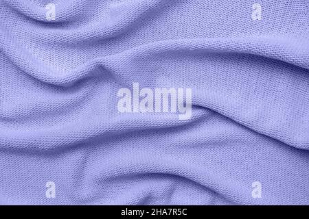 Color of the year 2022 very peri. Knitted sweater texture closeup. Trendy soft abstract background. Stock Photo