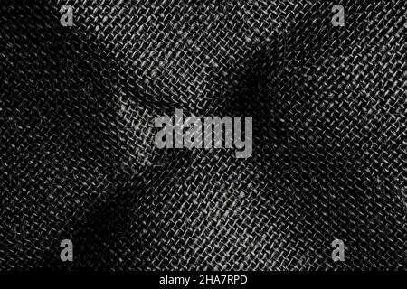 Black rough fabric woven burlap fabric. Textured dark background Stock Photo