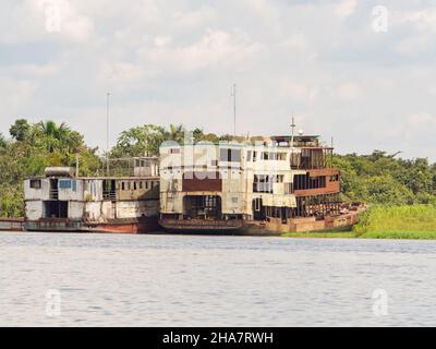 Iquitos, Peru- Dec , 2017: Abandoned, rusty boats on the bank of