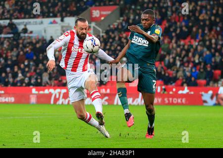 Steven Fletcher #9 of Stoke City  and Anfernee Dijksteel #2 of Middlesbrough challenge for the ball Stock Photo