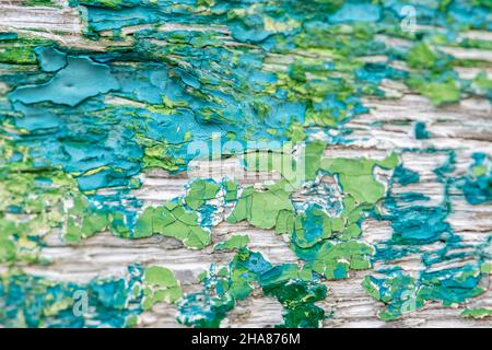 Flaked paint on a ship wreck, blue and green background Stock Photo