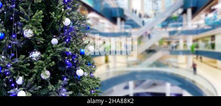 Abstract Blurry or Defocus Background of Shopping Mall with Christmas Tree with Light Decoration Stock Photo