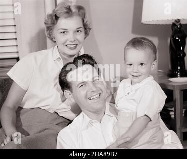 1950s PORTRAIT SMILING FAMILY FATHER MOTHER DAUGHTER SON STANDING ...