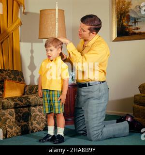 1970s MAN FATHER KNEELING ON FLOOR IN LIVING ROOM WITH CARPENTER FOLDING RULE MEASURE MEASURING HIS STANDING BOY SON’S HEIGHT - kj4523 HAR001 HARS 1 JUVENILE COMMUNICATION TEAMWORK INFORMATION STRONG SONS JOY PARENTING CELEBRATION CARPENTER HEALTHINESS HOME LIFE FULL-LENGTH PERSONS INSPIRATION CARING MALES FATHERS KNEELING HAPPINESS WELLNESS DISCOVERY HIS STRENGTH LIVING ROOM DADS EXCITEMENT HOW PROGRESS RECREATION PRIDE IN ON OPPORTUNITY CONNECTION CONCEPTUAL STYLISH PERSONAL ATTACHMENT AFFECTION EMOTION GROWTH JUVENILES MID-ADULT MID-ADULT MAN PRECISION RELAXATION SON'S TOGETHERNESS Stock Photo