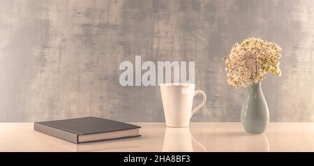 Book opened on a workspace. White pages for inscriptions. Stock Photo